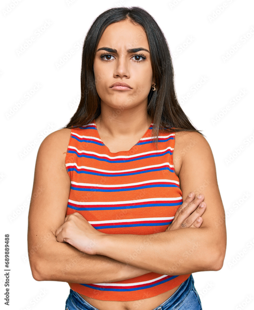 Young brunette woman wearing casual clothes skeptic and nervous, disapproving expression on face with crossed arms. negative person. Young brunette woman wearing casual clothes skeptic and nervous, disapproving expression on face with crossed arms. negative person.