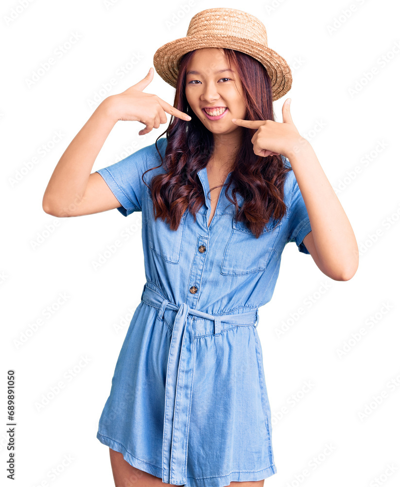 Φωτογραφία Young beautiful chinese girl wearing summer hat smiling cheerful showing and pointing with fingers teeth and mouth