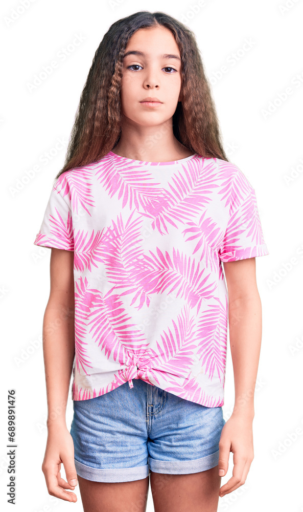 Obraz premium Cute hispanic child girl wearing casual clothes relaxed with serious expression on face. simple and natural looking at the camera.