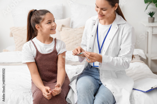 Little girl with doctor aft...