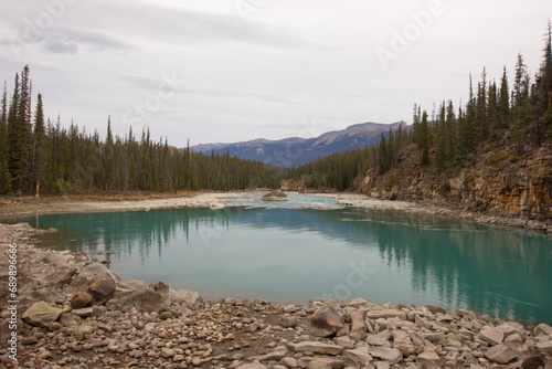 Green and blue Athabasca river in Alberta, Canada © Luciernaga