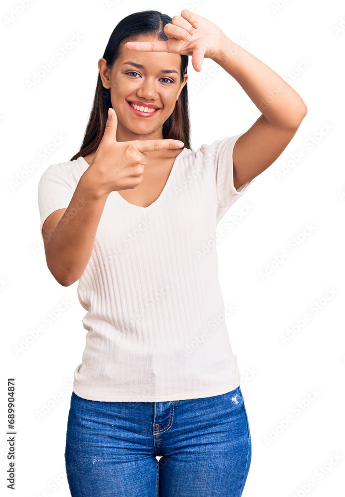 Young beautiful latin girl wearing casual white t shirt smiling making frame with hands and fingers with happy face. creativity and photography concept. Young beautiful latin girl wearing casual white t shirt smiling making frame with hands and fingers with happy face. creativity and photography concept.