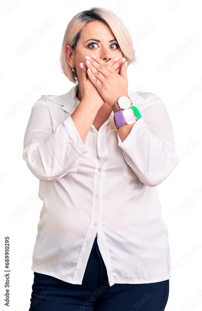Young blonde plus size woman wearing casual shirt shocked covering mouth with hands for mistake. secret concept. Young blonde plus size woman wearing casual shirt shocked covering mouth with hands for mistake. secret concept.
