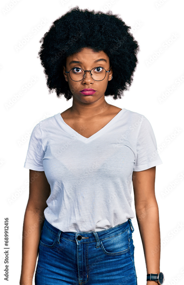 Young african american woman wearing casual white t shirt skeptic and nervous, frowning upset because of problem. negative person. Young african american woman wearing casual white t shirt skeptic and nervous, frowning upset because of problem. negative person.