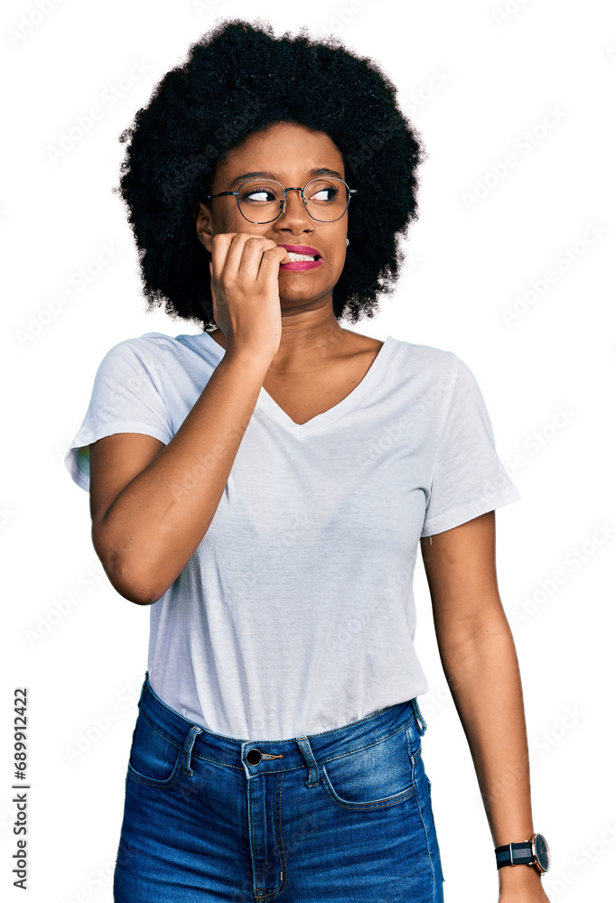 Young african american woman wearing casual white t shirt looking stressed and nervous with hands on mouth biting nails. anxiety problem. Young african american woman wearing casual white t shirt looking stressed and nervous with hands on mouth biting nails. anxiety problem.