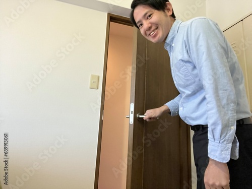 man opening door