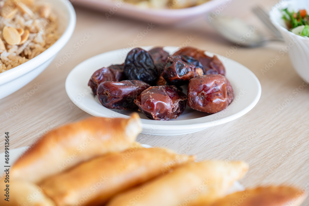 Qatayef and dates on ramadan dining table for iftar Qatayef and dates on ramadan dining table for iftar