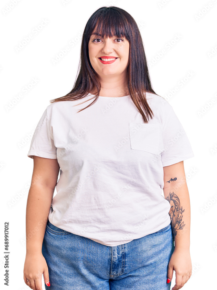Obraz premium Young plus size woman wearing casual clothes with a happy and cool smile on face. lucky person.