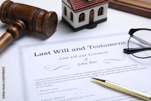 Last will and testament with pen on white table, closeup