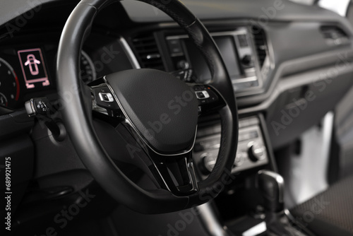 View of steering wheel and dashboard inside of modern car © New Africa