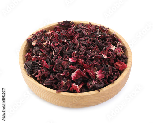 Hibiscus tea. Wooden bowl with dried roselle calyces isolated on white photo