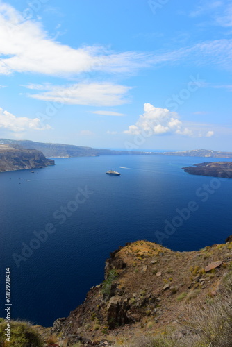 View of Skaros rock, a rocky headland that protrudes out to the azure blue Aegean Sea, Imerovigli, Santorini, Greece. This was on a hot sunny afternoon. 