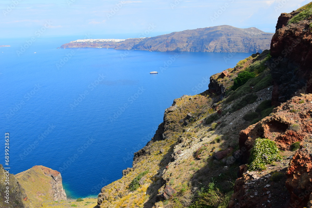 View of Skaros rock, a rocky headland that protrudes out to the azure blue Aegean Sea, Imerovigli, Santorini, Greece. This was on a hot sunny afternoon.
