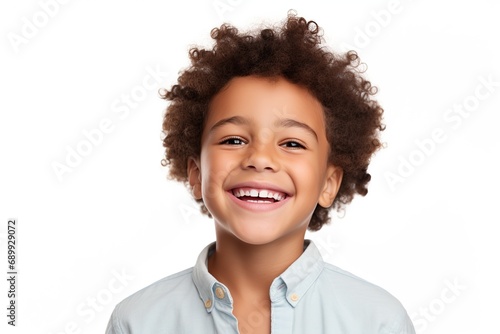 Cute mixed race boy child model with perfect clean teeth laughing and smiling.
