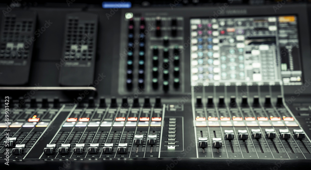 Professional audio studio sound mixer console board panel with recording , faders and adjusting knobs,TV equipment, selective focus