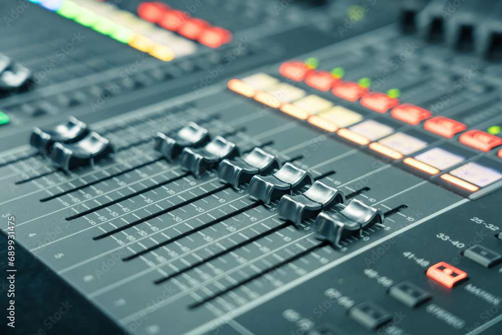 Professional audio studio sound mixer console board panel with recording , faders and adjusting knobs,TV equipment, selective focus Professional audio studio sound mixer console board panel with recording , faders and adjusting knobs,TV equipment, selective focus