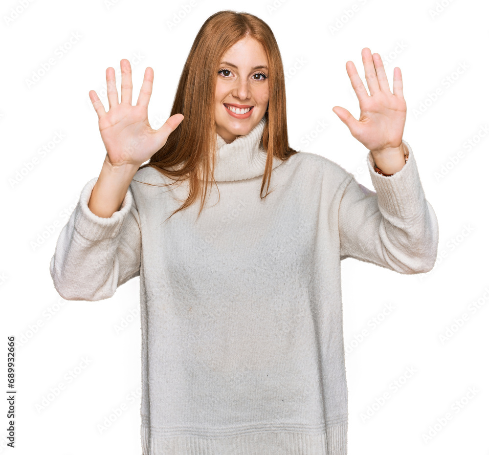 Young irish woman wearing casual winter sweater showing and pointing up with fingers number ten while smiling confident and happy. Young irish woman wearing casual winter sweater showing and pointing up with fingers number ten while smiling confident and happy.