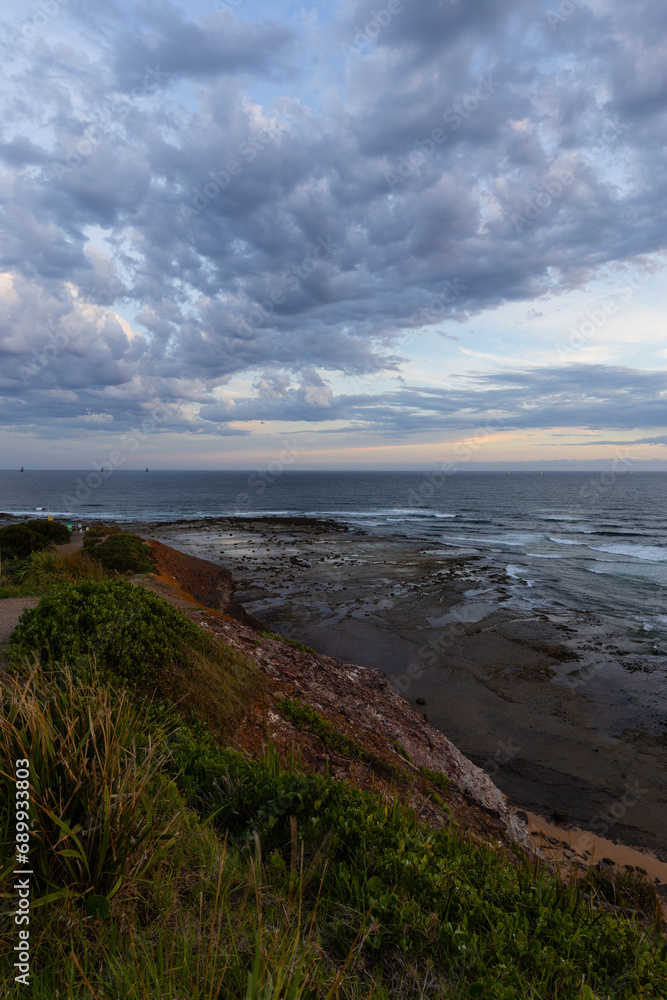 Cloudy sunset view at Long Reef headland, Sydney, Australia.