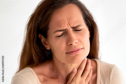 Woman with closed eyes and chestnut hair with chest pains