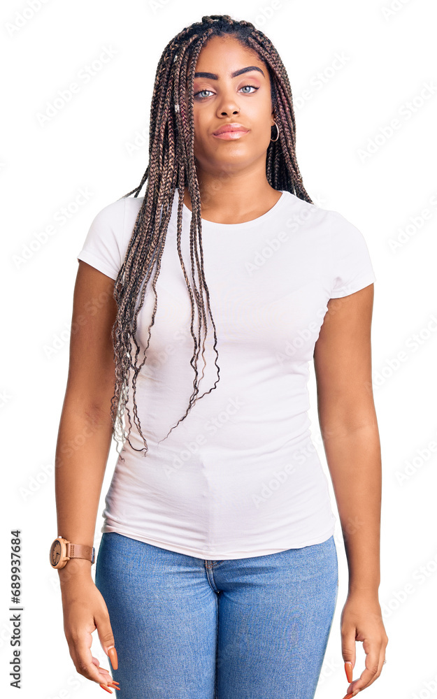 Young african american woman with braids wearing casual clothes relaxed with serious expression on face. simple and natural looking at the camera. Young african american woman with braids wearing casual clothes relaxed with serious expression on face. simple and natural looking at the camera.