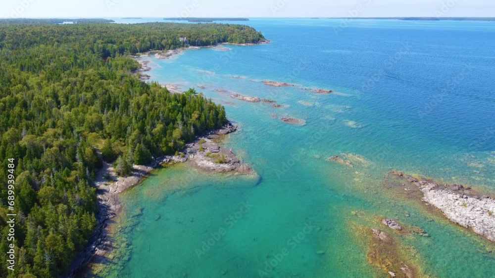 Aerial Establish shot of Georgian Bay on lake Huron, clear water and pine forest Aerial Establish shot of Georgian Bay on lake Huron, clear water and pine forest