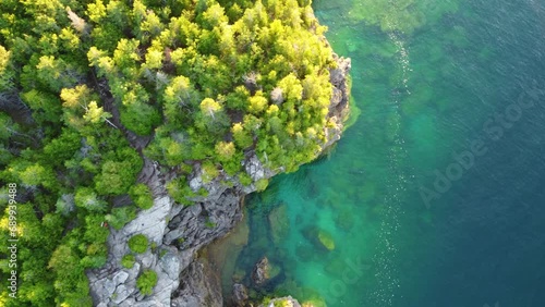 Descending On Eroded Rock Cliffs In Georgian Bay Islands National Park, Ontario, Canada. Aerial Drone Shot photo