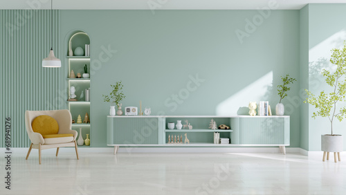 Modern minimal Mockup a TV wall mounted with armchair with green tv sideboard in living room ,Green pastel wall.3d rendering