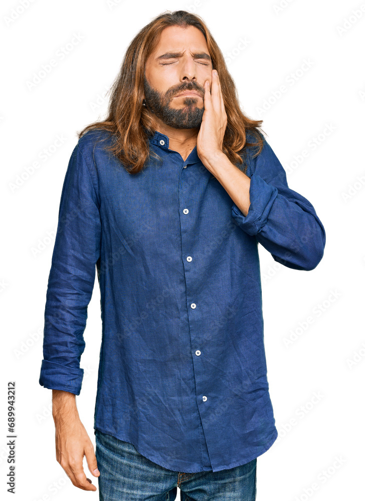 Attractive man with long hair and beard wearing casual clothes touching mouth with hand with painful expression because of toothache or dental illness on teeth. dentist Attractive man with long hair and beard wearing casual clothes touching mouth with hand with painful expression because of toothache or dental illness on teeth. dentist