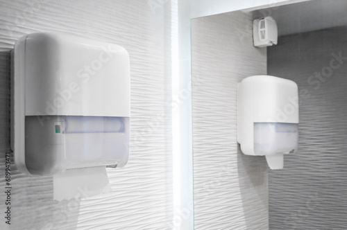 Paper towel dispenser for washing hands, clean minimal scene photo