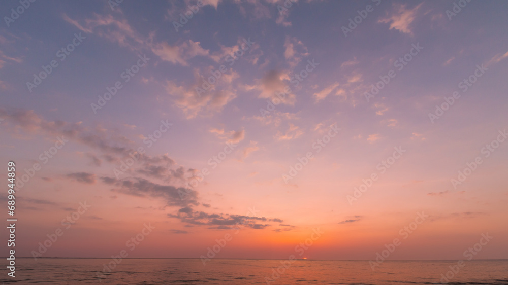 Beautiful colorful sunset with dramatic clouds and sun shining Beautiful colorful sunset with dramatic clouds and sun shining