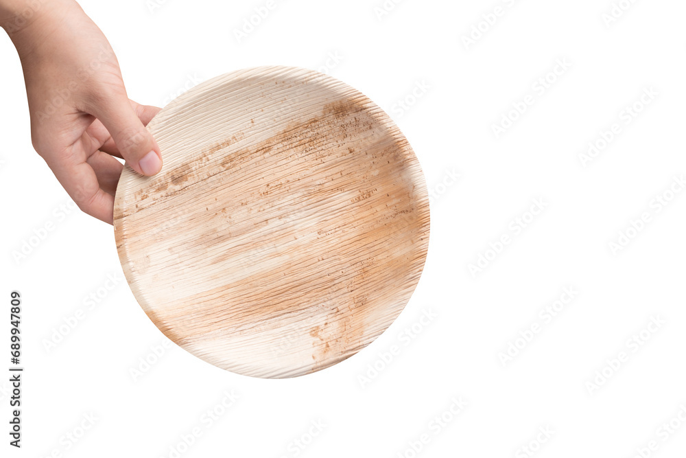 Biodegradable dish made from betel palm leaf holding by hand, Sustainability concept Biodegradable dish made from betel palm leaf holding by hand, Sustainability concept