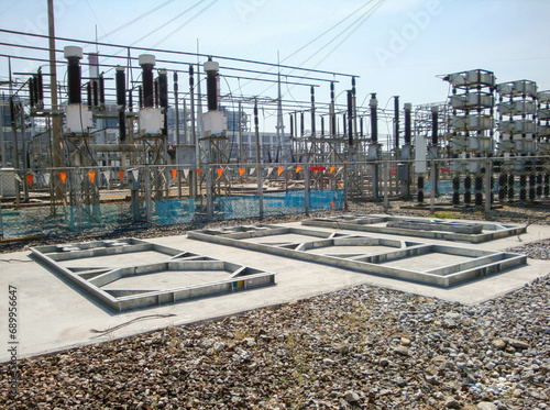 Steel skid base foundation on concrete for installed high voltage equipment in the substation.