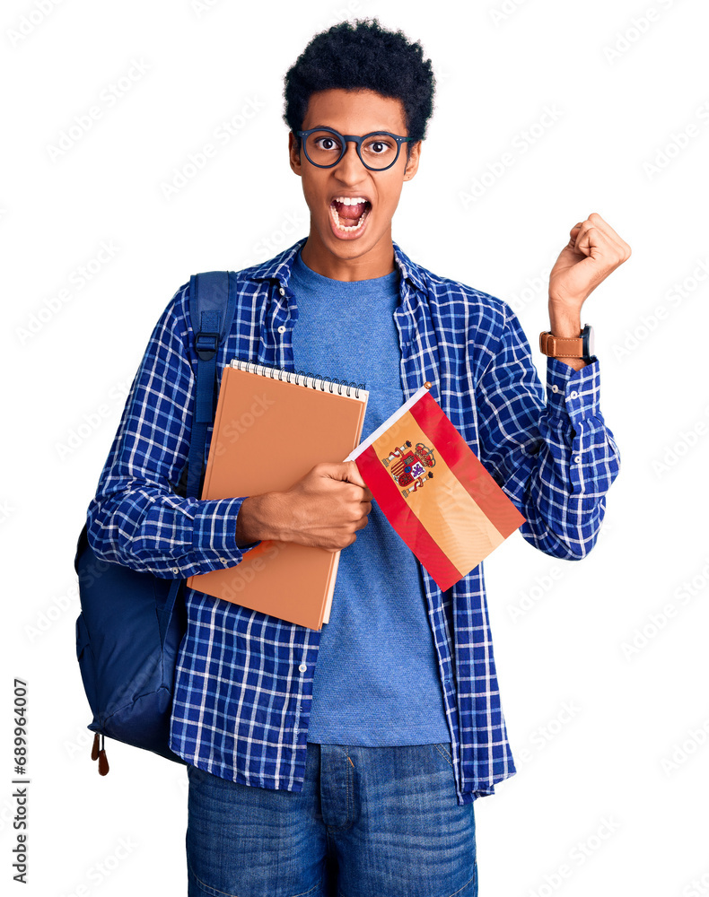 Young african american man wearing student backpack holding spanish flag screaming proud, celebrating victory and success very excited with raised arms