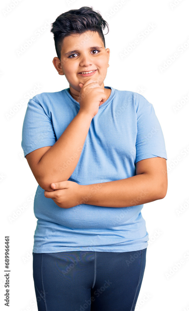 Little boy kid wearing sports workout clothes looking confident at the camera with smile with crossed arms and hand raised on chin. thinking positive. Little boy kid wearing sports workout clothes looking confident at the camera with smile with crossed arms and hand raised on chin. thinking positive.