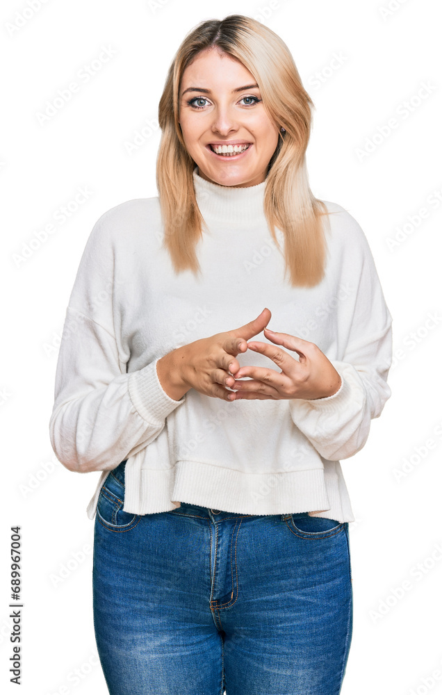 Young caucasian woman wearing casual winter sweater hands together and fingers crossed smiling relaxed and cheerful. success and optimistic Young caucasian woman wearing casual winter sweater hands together and fingers crossed smiling relaxed and cheerful. success and optimistic