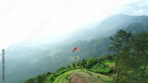 Aerial view of the paragliding attraction at Puncak Lawang, Agam Regency, West Sumatra photo