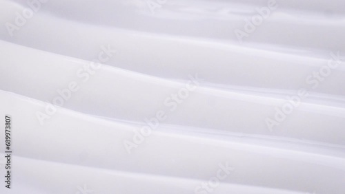  glass tubes form a wavy texture of thick white shampoo photo