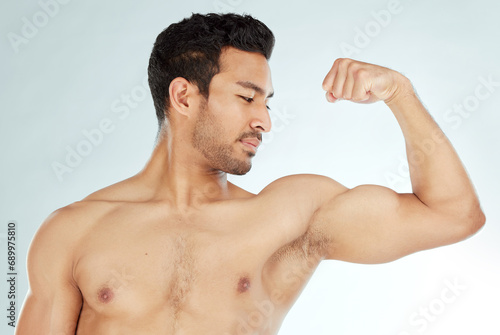 Fitness, bicep flex and asian man in studio for wellness, training or workout results on white background. Body, exercise and Japanese male model with strong arm pose for strength or muscle growth