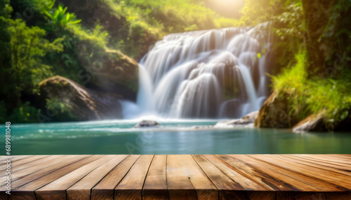 Empty wooden table on blurred waterfall background © Zohaib zahid 