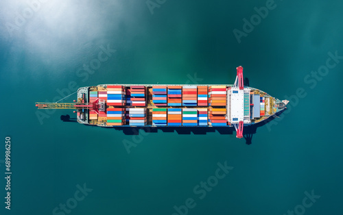 Aerial top view container ship for import export logistics sailing in Blue Ocean background, business global idea freight 