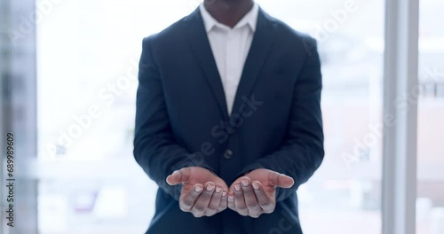 Businessman, hands and donation in care, offer or sharing opportunity by window at office. Closeup of black man or employee asking for help, borrow or financial aid and salary increase at workplace photo
