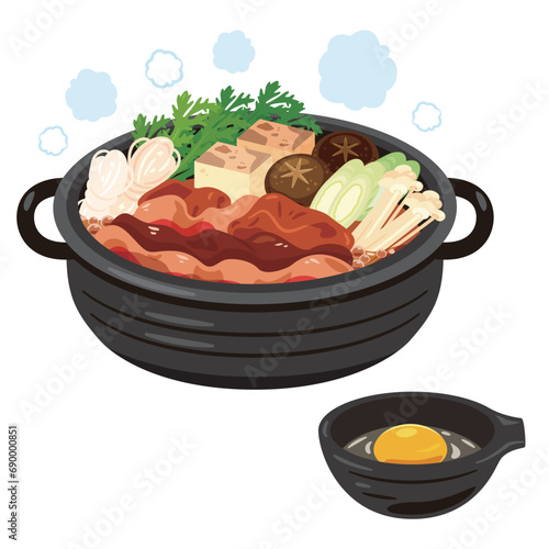 すき焼き鍋と生卵が入った取り皿
