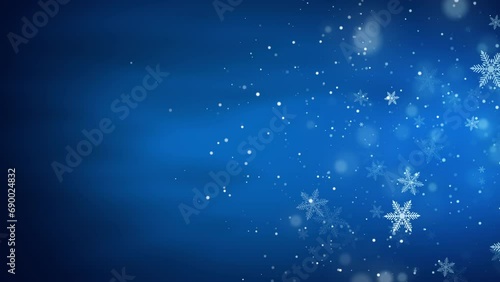Abstract blue winter background with snow and snowflakes for christmas season. Loop animation.