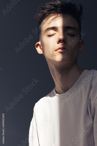 Portrait of adolescent with closed eyes