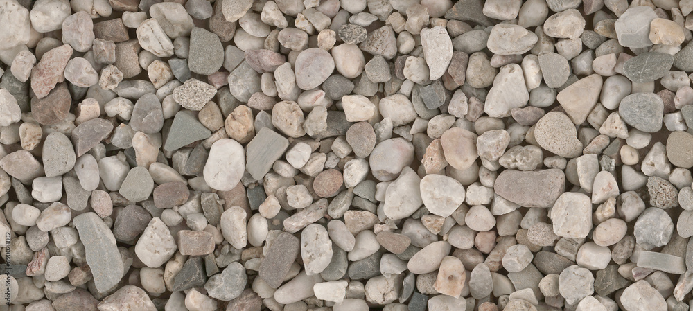 Small round stones background. Stone texture. Rough surface of small pebble stone. Small round stones background. Stone texture. Rough surface of small pebble stone.