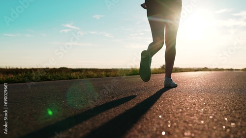 silhouette sports girl running along road sunset, legs close-up, sport leisure fitness, young asian women training outdoors, jogging, goal achievement, marathon preparation lifestyle, triathlon