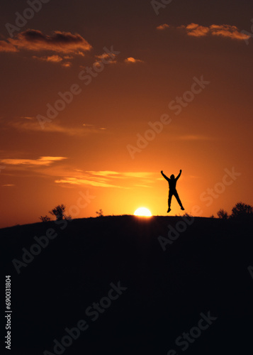 silhouette of a person jumping