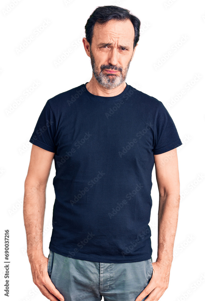 Middle age handsome man wearing casual t-shirt depressed and worry for distress, crying angry and afraid. sad expression. Middle age handsome man wearing casual t-shirt depressed and worry for distress, crying angry and afraid. sad expression.