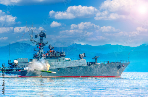 Russian warship going along the coast of Pacific ocean on Kamchatka peninsula photo