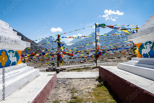 prayer flags in a buddhist stupa area photo